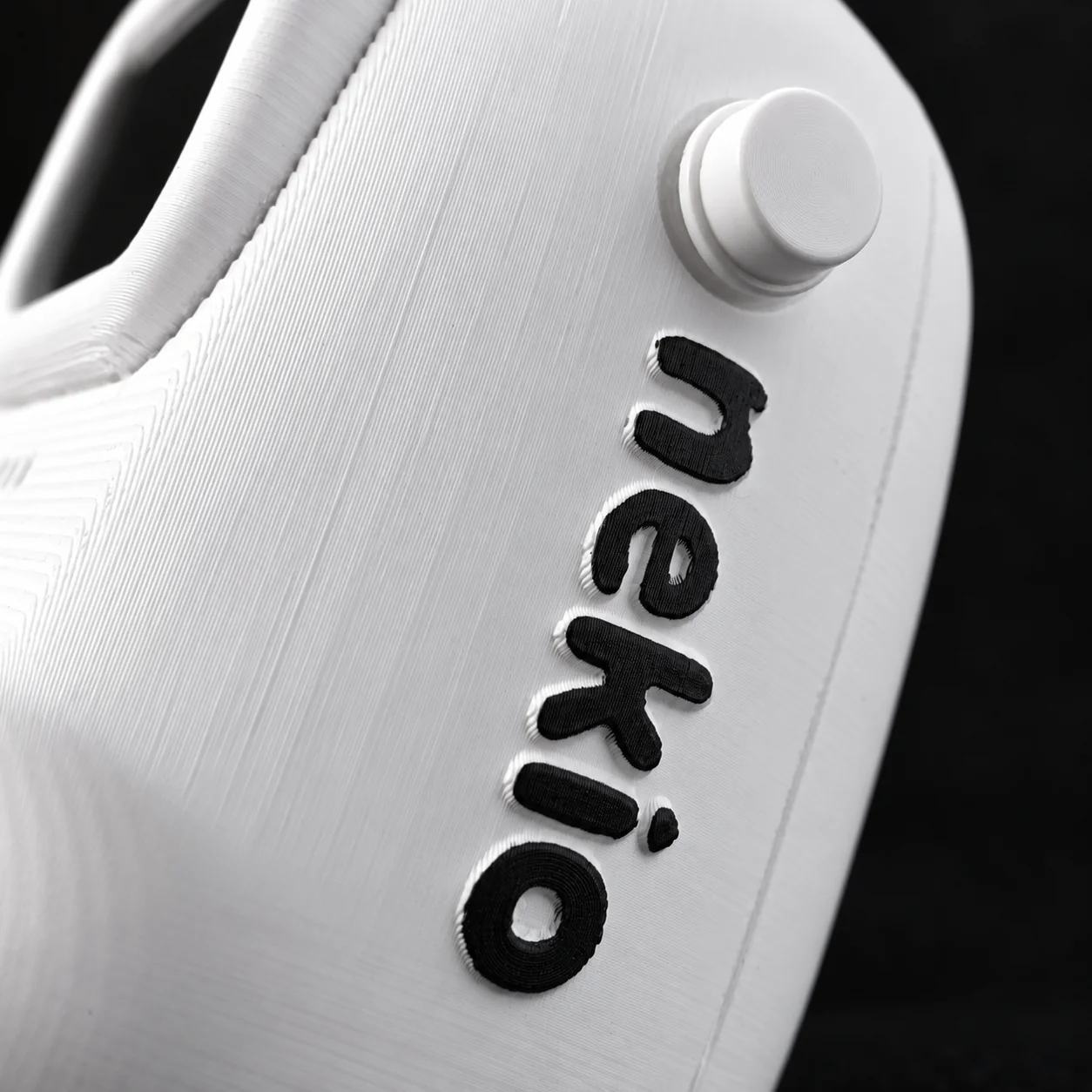 Close-up of nek.io’s power button