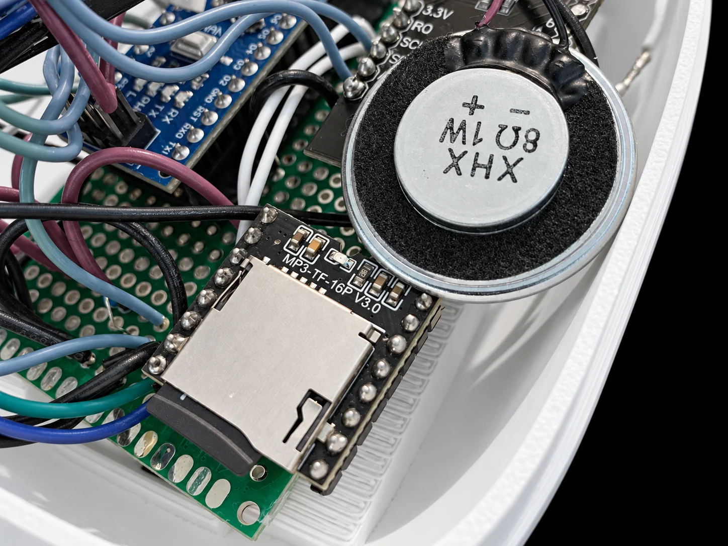 DFPlayer Mini and speaker inside the shell